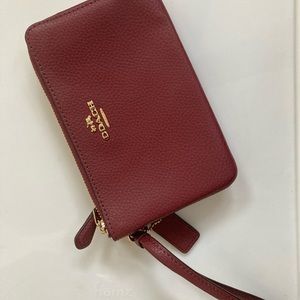 Beautiful coach wristlet! Never used! Cute color and practical!